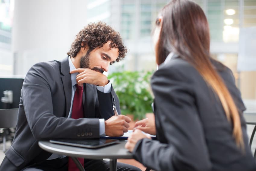 Business people signing a contract